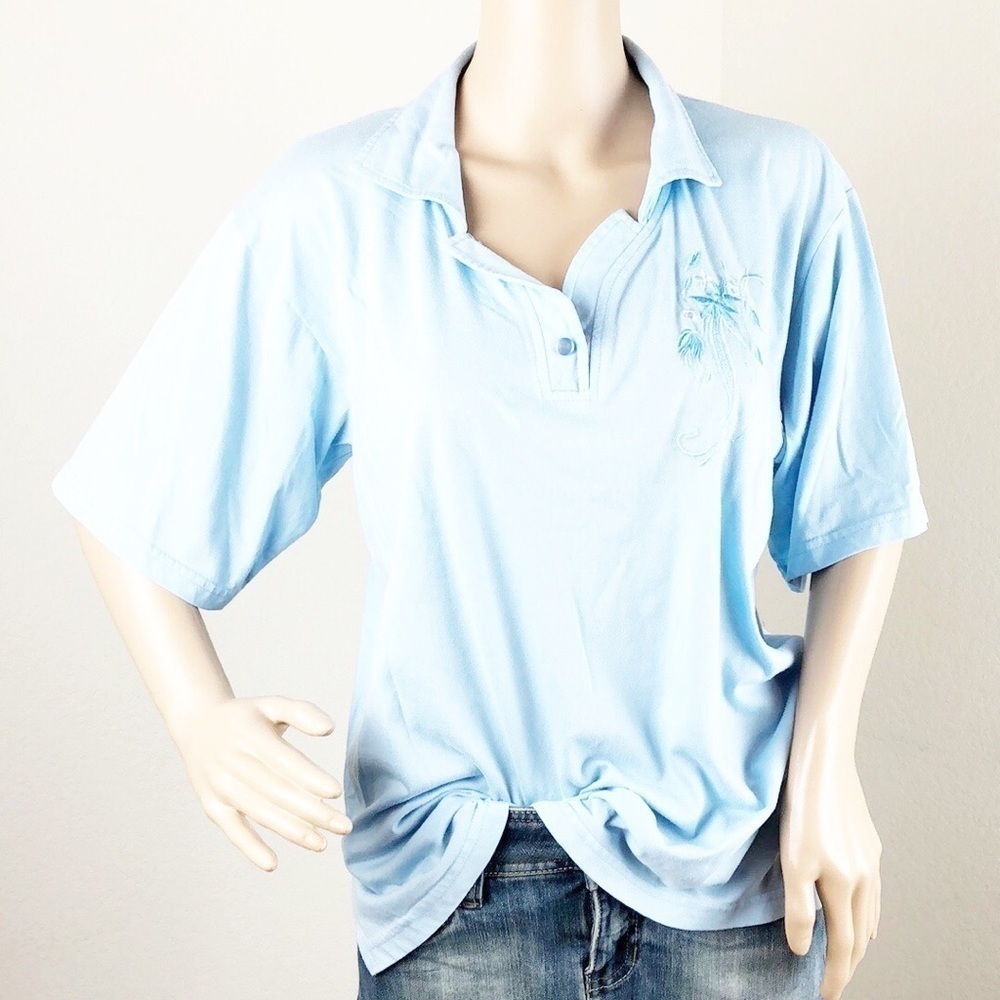 Young light blue floral embroidered top